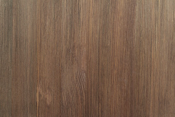 Naklejka premium Natural color wooden board surface. Textured background from woodnut planks. Vertical grain.