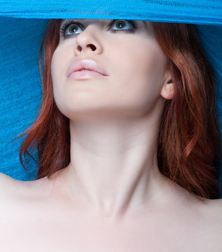 Sexy female model posing with blue scarf
