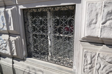 old ground floor window with a cage