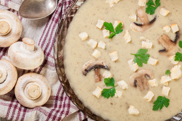 Mushroom cream soup with croutons and spices