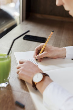 woman writing in a notebok