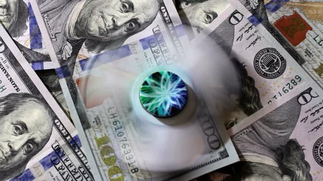 Glowing Spinner Rotates On The Hundred Dollar Denomination