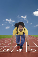 Young man at starting position of race