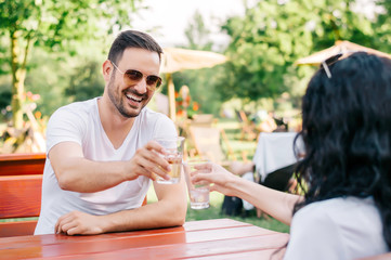 Couple having good time in street cafe