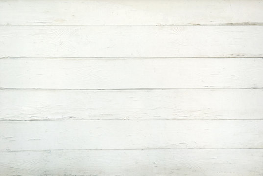 A background of weathered white painted wood
