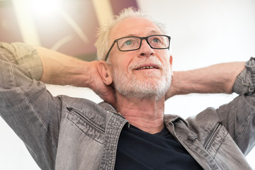 Obraz premium Relaxed man daydreaming, light effect