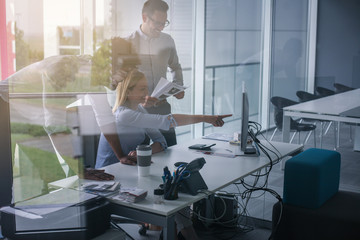 Business people using technology and having conversation. Business people at the office.