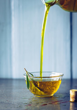 Olive oil with olive twig