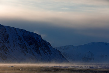 Fog in ocean. White snowy mountain, blue glacier Svalbard, Norway. Ice in ocean. Iceberg twilight in North pole. Pink clouds with ice floe. Beautiful landscape. Land of ice. Cold blue water nature. © ondrejprosicky