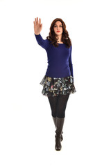 full length portrait of brunette girl wearing casual modern clothes, standing pose, isolated against white background.