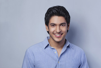 Close-up portrait of young man smiling 