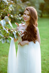 Brunette bride in fashion white wedding dress with makeup