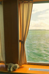 Obraz premium Window with a curtain on a ferry