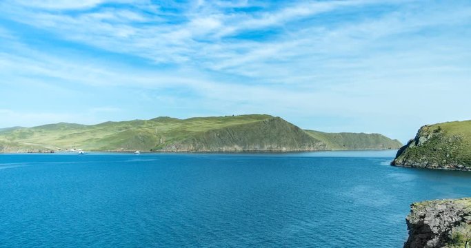 Timelapse. Ferries run between the mainland and the island Olkhon in lake baikal. Fast moving clouds.
