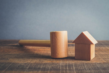 Symbol of worldwide real estate crisis. wood hammer and house with filter effect retro vintage style