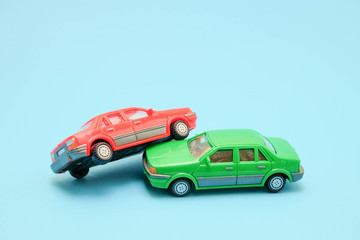 Toy cars in accident on a blue background