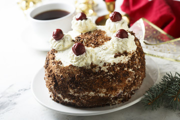 Chocolate and whipped cream cake with cherries