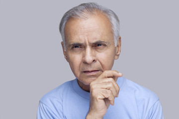Close-up of elderly man thinking 