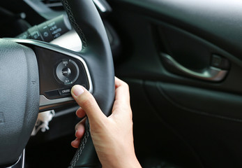 Hand using Cruise control.