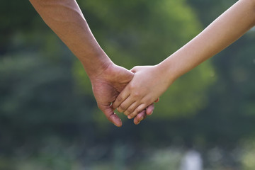 Close-up of couple holding hands 