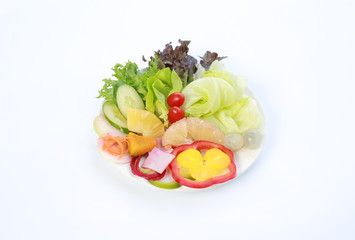 Fresh vegetable salad isolated on white.
