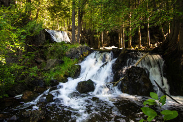 Fototapeta premium Upper Peninsula Michigan Roadside Waterfall. Fumee Falls is a beautiful waterfall located in a roadside park along US-2 in Dickinson County in the Upper Peninsula of Michigan.