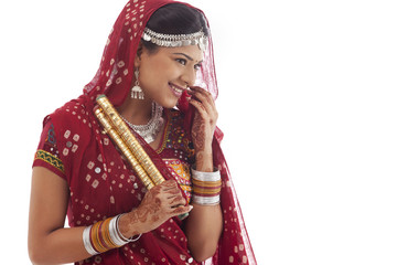 Female dandiya dancer with sticks 