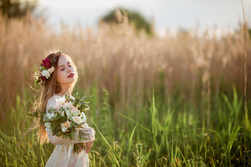 Elegant girl in wheat ears