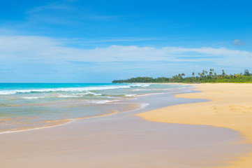 Beautiful ocean, long sandy beach and sky