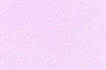 Texture of old light violet paper background, closeup. Structure of dense lilac cardboard