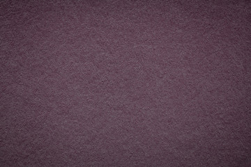 Fototapeta premium Texture of old dark wine paper background, closeup. Structure of dense purple cardboard