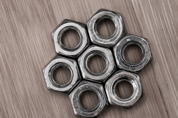a bunch of metal nuts