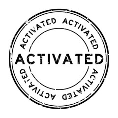 Grunge black activated rubber seal stamp on white background