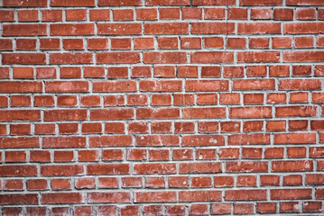 red brick wall texture grunge background with vignetted corners to interior design