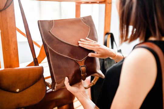 Handmade vintage crafted authentic leather high quality woman handbag on the sale at the window in shop