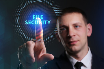 Business, Technology, Internet and network concept. Young businessman working on a virtual screen of the future and sees the inscription: File security