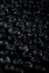 Fresh ripe blueberries pattern dark photo macro