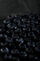 Fresh ripe blueberries pattern dark photo macro