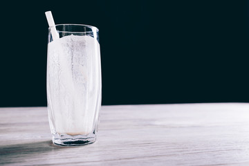 Close-up of empty glass with a straw from a smoothie