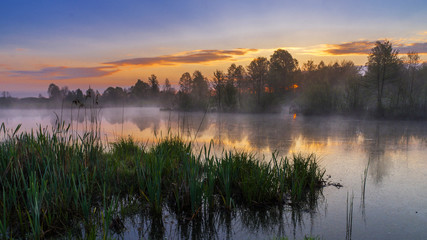 Fototapeta na wymiar Sunrise at lake,may morning