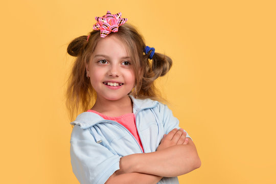 Kid With Cute Pink Bow On Head And Messy Hair