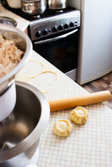 Sculpt russian pies kurniki rolling pin in kitchen interior. © Olga