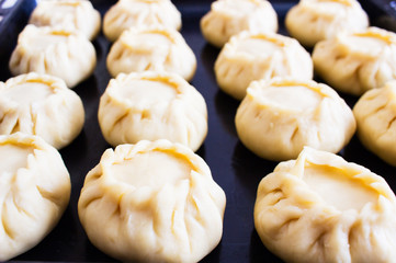 Lot russian pies kurniki on dripping pan. © Olga