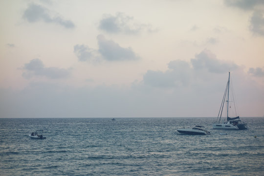 sailing boats on sea in the evening