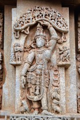 Sculpture of Krishna lifting the Govardhana mountain at Veera Narayana Hoysala temple , Belavadi, Karnataka