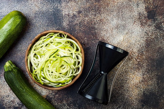 Zucchini spaghetti or noodles (zoodles) bowl. Top view, copy space