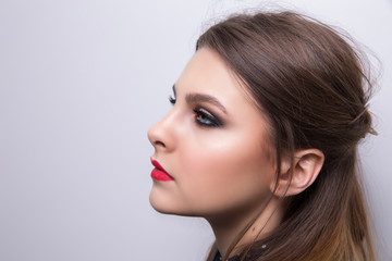 Fashionable portrait of a girl model with red lips.