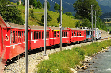 Naklejka premium Switzerland:July 2012, Swiss mountain Red Train Bernina Express from Tirano (Italy) to St. Moritz (Switzerland). 