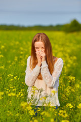 Pollen allergy, girl sneezing