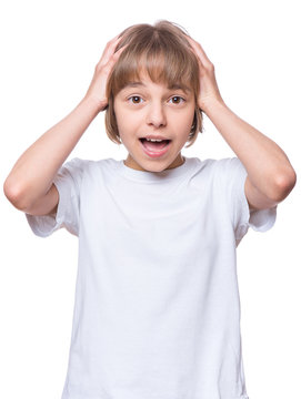 Portrait of little surprised girl excited scared. Shocked teenager in blank t-shirt, isolated on white background.